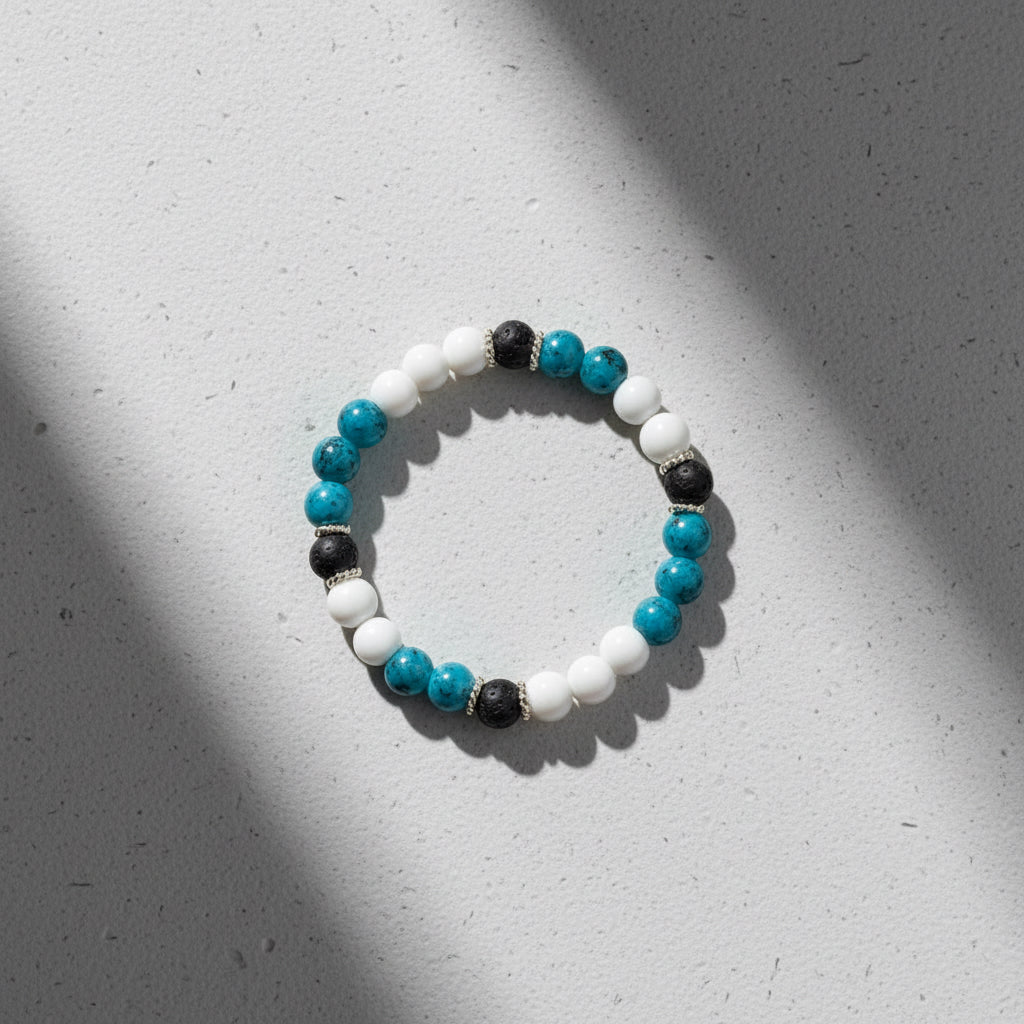 Teal agate, white howlite and black lava stone beaded bracelet