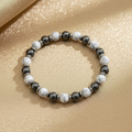 White Howlite & Hematite Bracelet – Gold Background